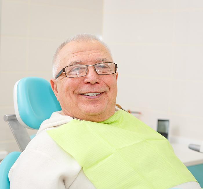 Senior man with All-on-4 in Minot, MD in dental chair