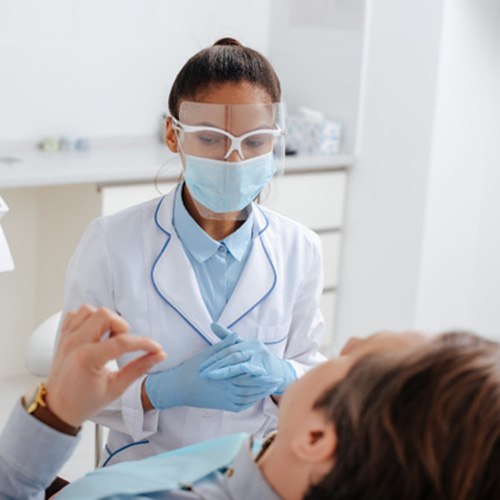 Woman giving thumbs up for BOTOX for TMJ pain relief in Minot