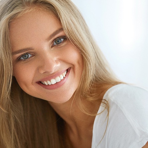 A woman pleased with her healthier smile