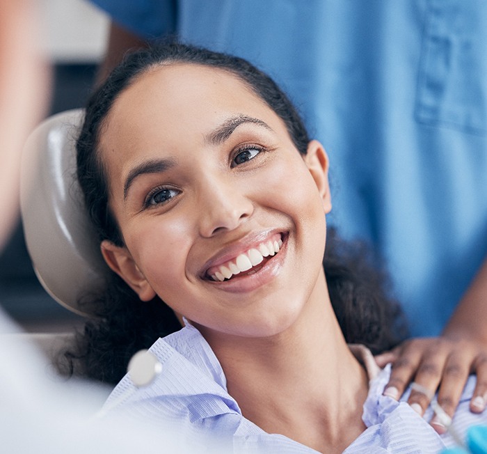 Patient in Minot smiling after dental checkup and cleaning