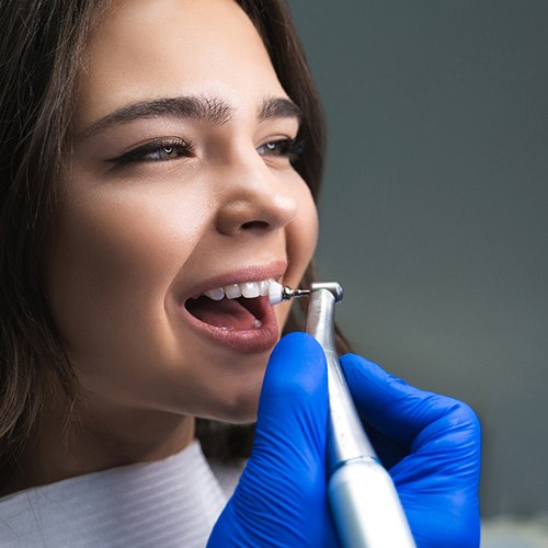 Dental hygienist polishing a patient’s teeth