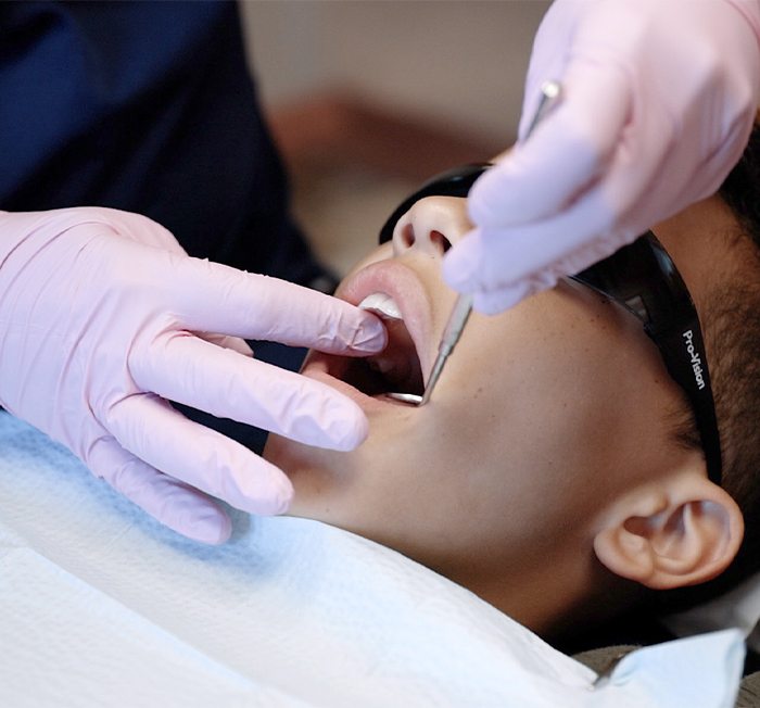 Group of kids smiling together after children's dentistry visit