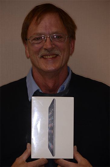 Dental patient holding a prize