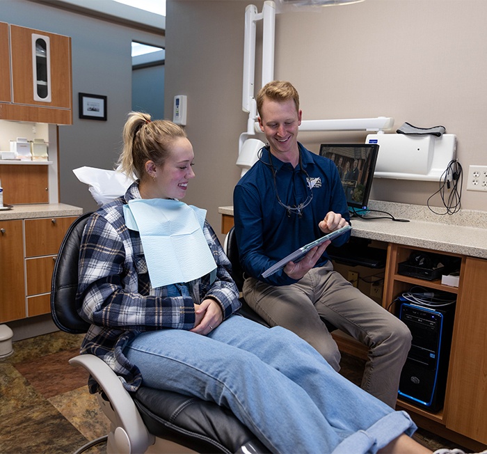 Woman smiling after cosmetic dentistry treatment