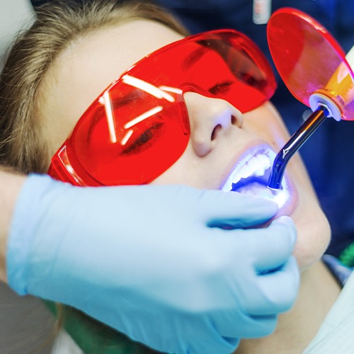 Woman receiving dental bonding treatment