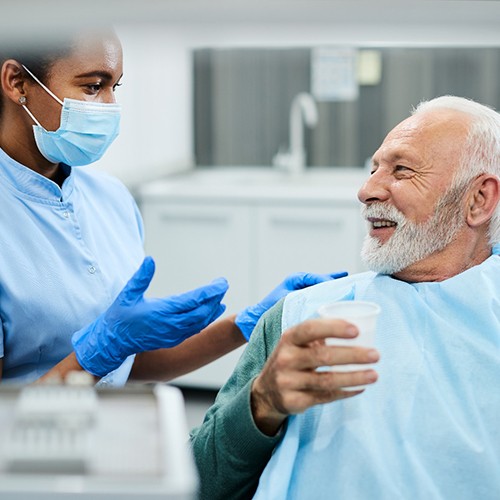 patient visiting dentist for dental emergency in Minot
