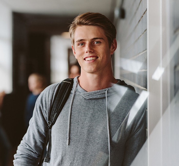 Young man smiling after tooth extraction