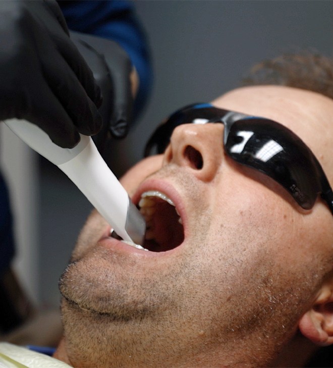 Man receiving digital scans of his teeth
