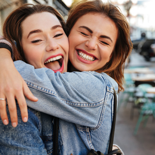 Invisalign patient in Minot smiling with friend