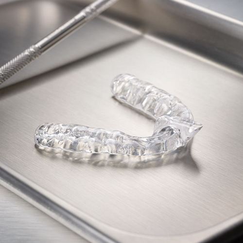 Clear nightguard for bruxism on metal tray