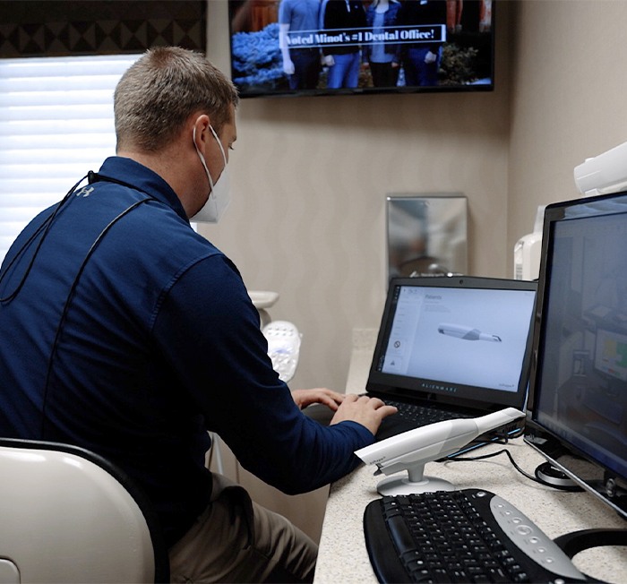 Female dental patient receiving 3 D C T x-ray scan