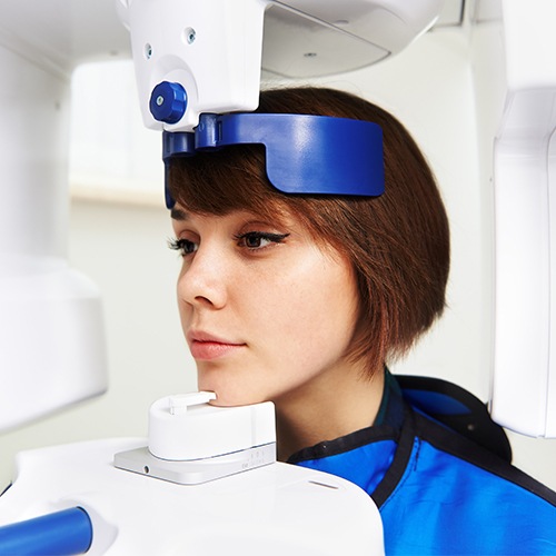 Woman receiving C T cone beam x-ray scan