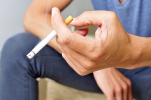 Man smoking a cigarette.