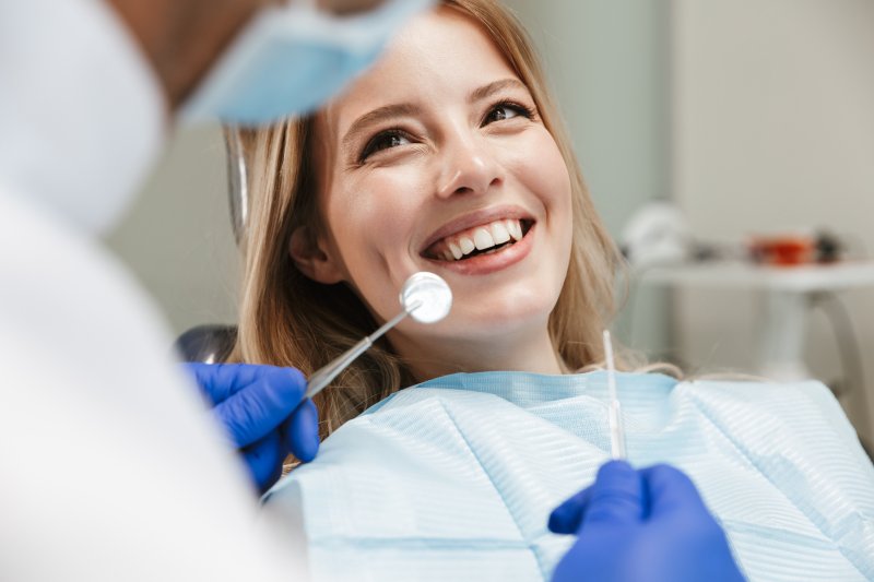 Woman sits in dentist's chair